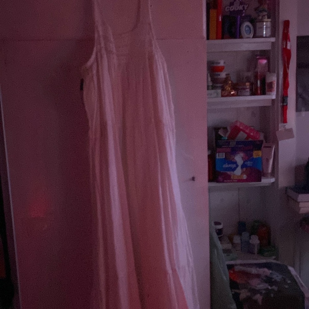 here is a cute plain white summer dress size medium and never worn